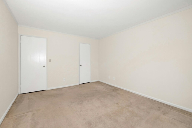 carpeted empty room with ornamental molding