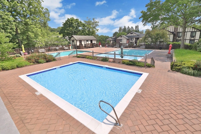 view of swimming pool with a patio area