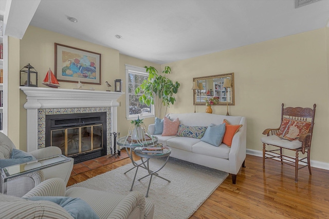 living room featuring a fireplace and light hardwood / wood-style floors