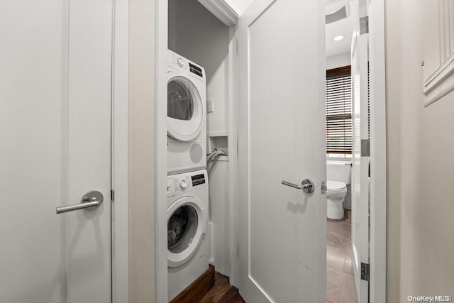 laundry room with stacked washer and clothes dryer