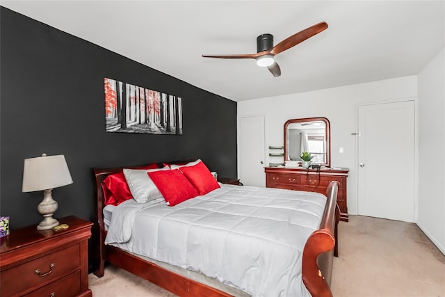 carpeted bedroom featuring ceiling fan