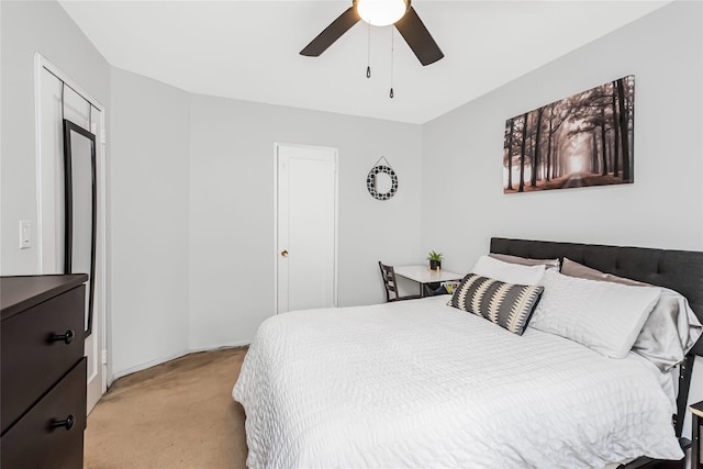 bedroom featuring ceiling fan and light carpet