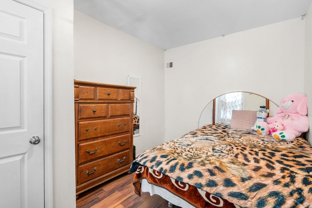 bedroom featuring hardwood / wood-style floors