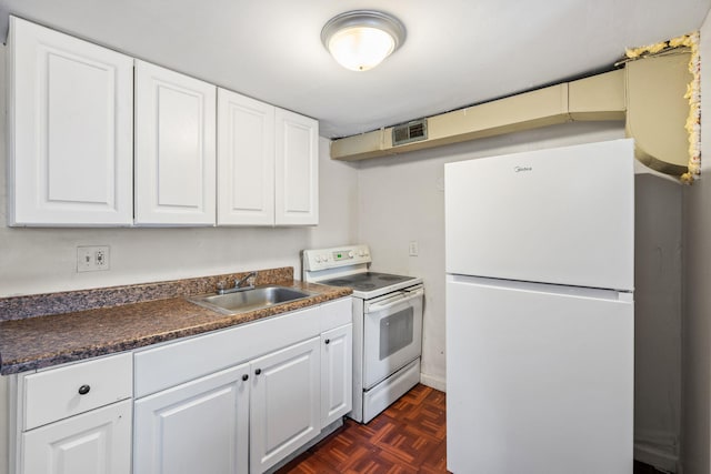 kitchen with white cabinetry, white appliances, sink, and dark parquet floors