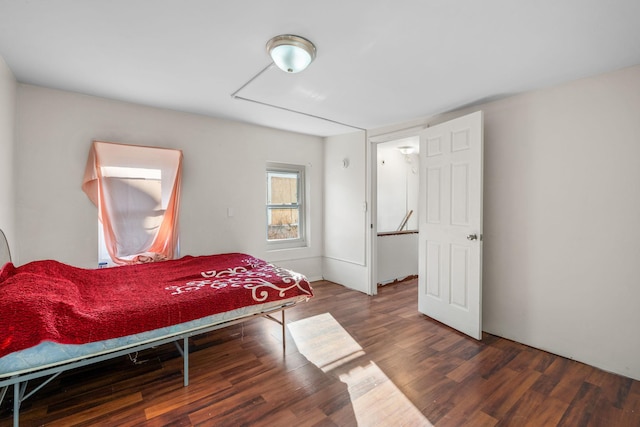 bedroom featuring dark wood-type flooring