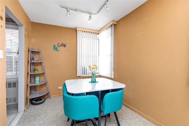 209-20 18th Ave Unit 6C, Bayside, NY 11360 - carpeted dining space with track lighting, radiator heating unit, and baseboards