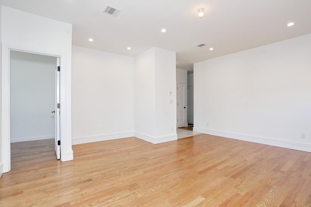 spare room with light hardwood / wood-style floors