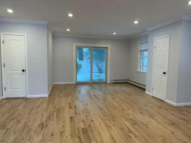 unfurnished room featuring a baseboard heating unit, light hardwood / wood-style flooring, and ornamental molding