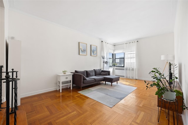 living area featuring baseboards