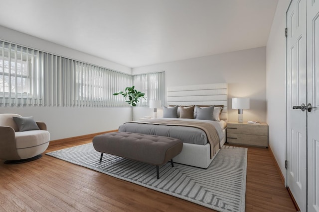 bedroom with hardwood / wood-style floors