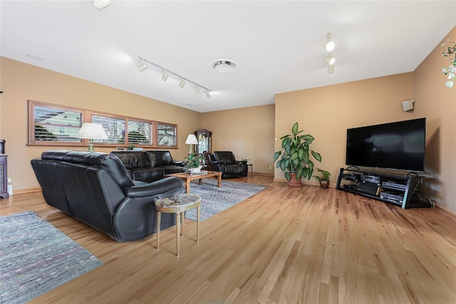 living room featuring track lighting and light wood-type flooring