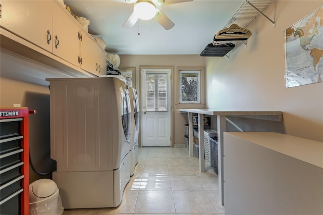 laundry area featuring washing machine and dryer, cabinets, ceiling fan, and light tile patterned flooring