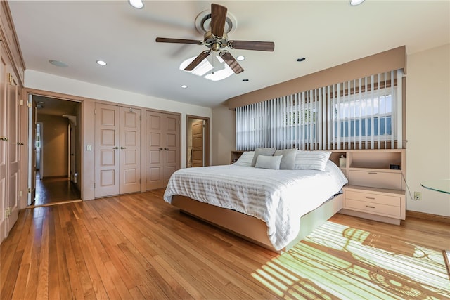 bedroom featuring ceiling fan, light wood-type flooring, and a closet