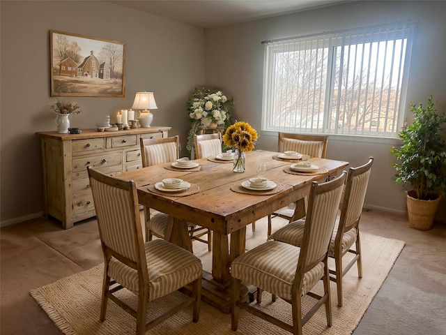 view of carpeted dining space