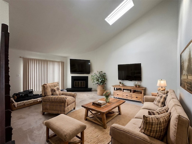 living room featuring a skylight, high vaulted ceiling, and light carpet