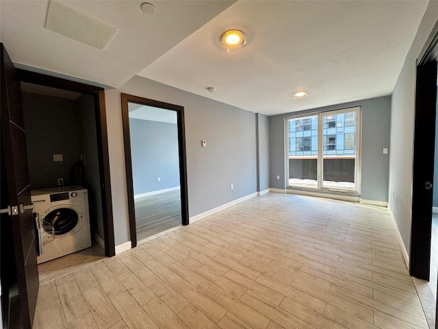 interior space with washer / clothes dryer and light hardwood / wood-style floors