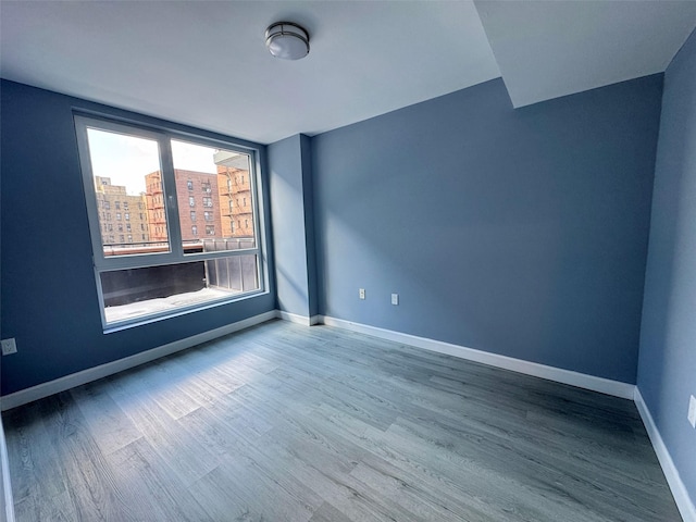 spare room featuring hardwood / wood-style floors