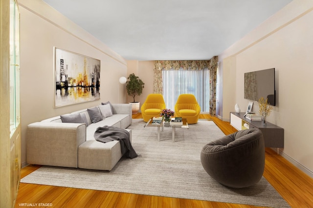 living room with wood finished floors and baseboards