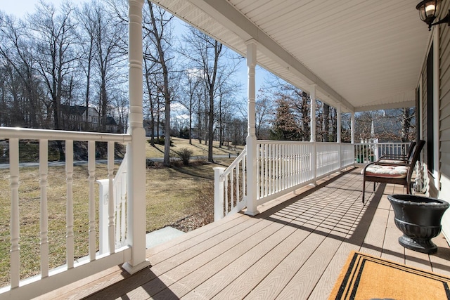 wooden terrace with a porch