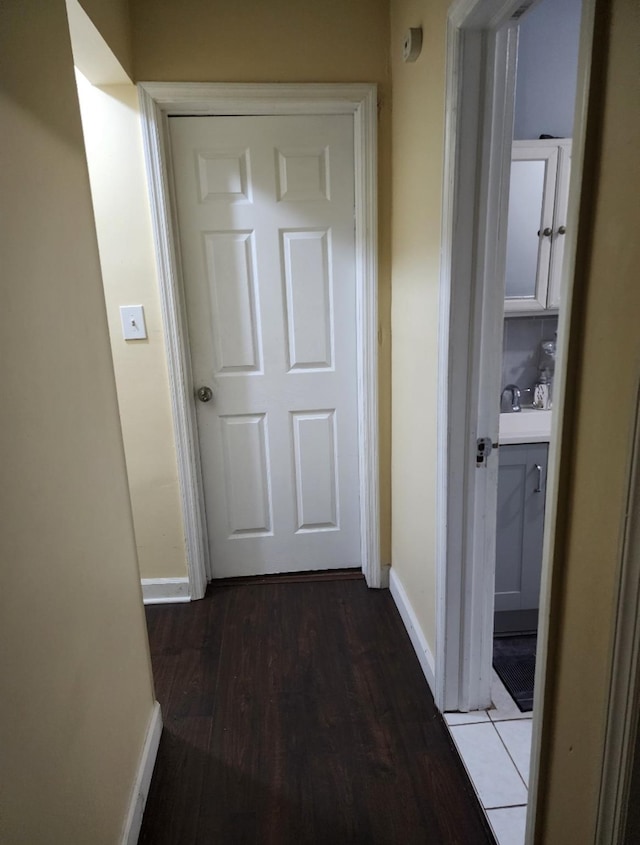 corridor with dark wood-type flooring