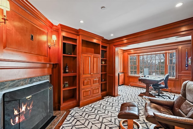 interior space featuring a high end fireplace, light carpet, and recessed lighting