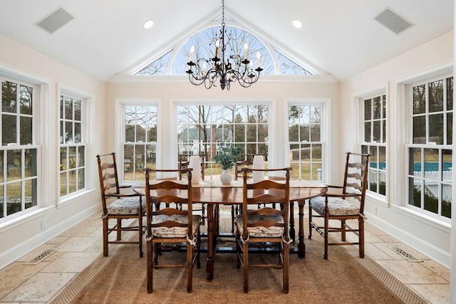 sunroom with visible vents, a chandelier, and vaulted ceiling