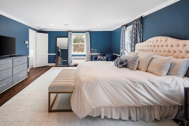 bedroom featuring radiator, dark wood-style flooring, crown molding, and recessed lighting