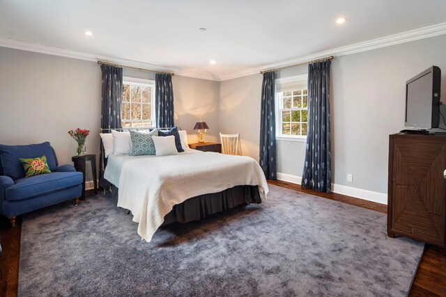 bedroom with recessed lighting, baseboards, crown molding, and wood finished floors