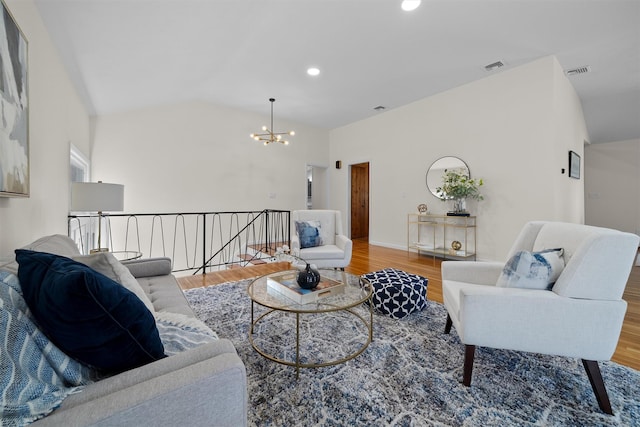 living room with recessed lighting, a notable chandelier, wood finished floors, and visible vents