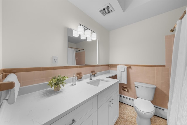 bathroom with tile walls, visible vents, toilet, and a baseboard heating unit