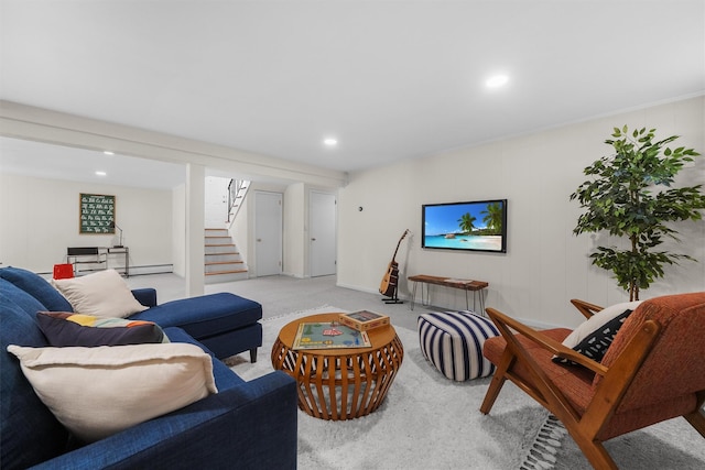 living area with recessed lighting, a baseboard heating unit, light colored carpet, and stairs