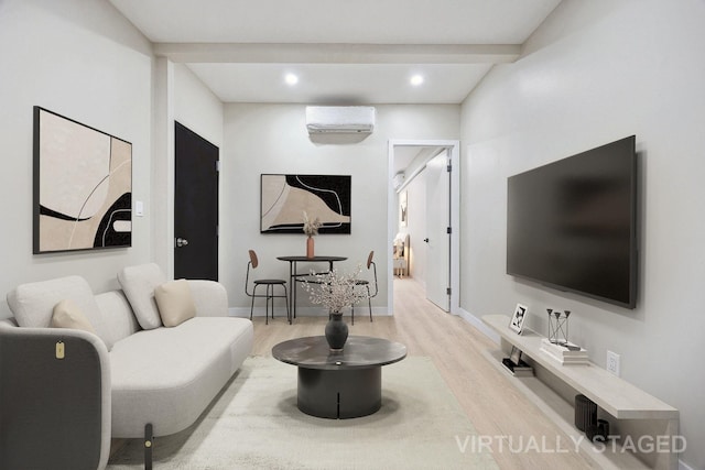 living room with a wall mounted air conditioner, beam ceiling, and light hardwood / wood-style flooring