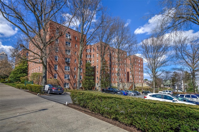 view of property with uncovered parking