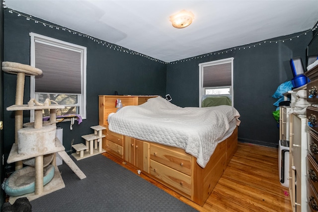 bedroom with wood finished floors