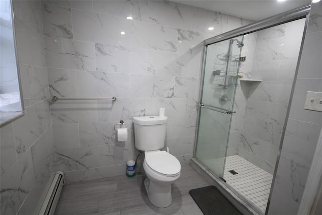 bathroom with an enclosed shower, a baseboard heating unit, and toilet