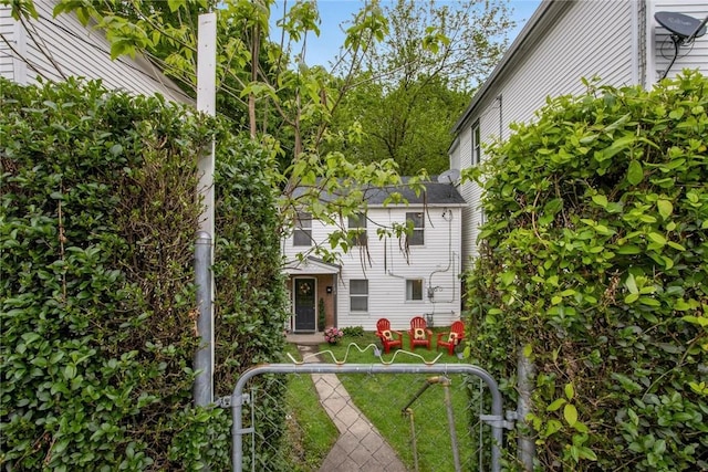 exterior space with a gate and a fenced front yard