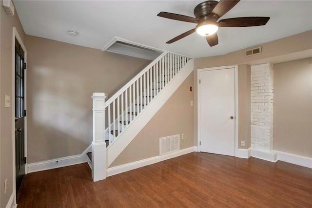 stairs featuring ceiling fan, visible vents, and wood finished floors