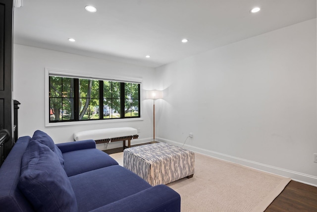 living area featuring recessed lighting, wood finished floors, and baseboards