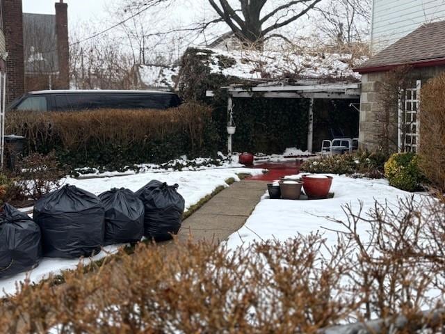 view of yard layered in snow