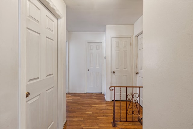 corridor featuring dark hardwood / wood-style floors