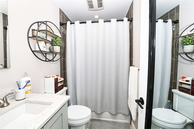 2355 Pershing Blvd Unit 712, Baldwin, NY 11510 - full bathroom with vanity, shower / bathtub combination with curtain, and toilet