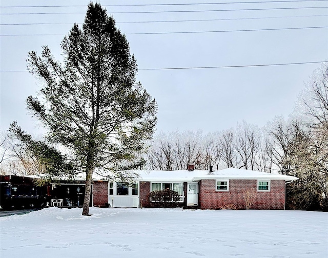 single story home with brick siding