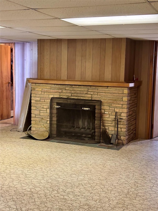 room details with a brick fireplace and wooden walls