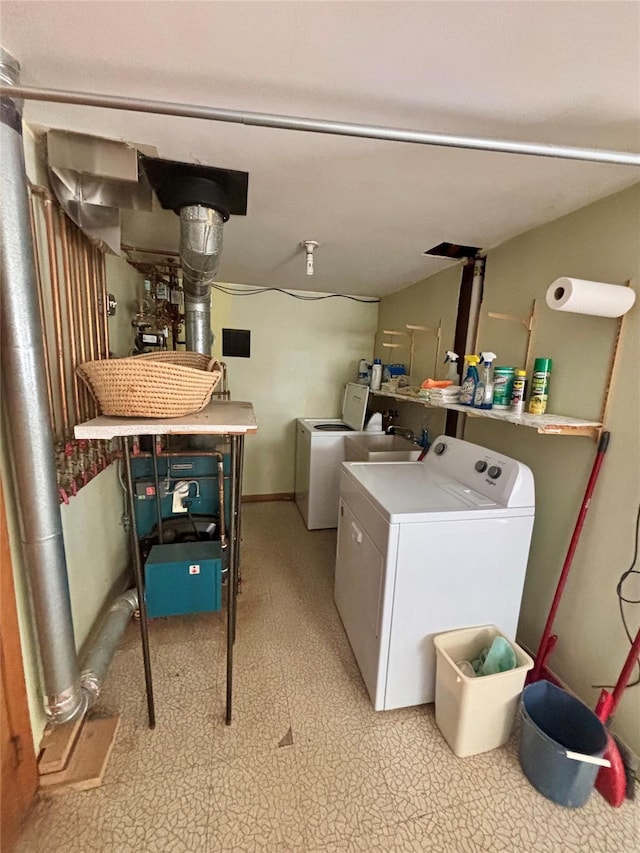 washroom featuring laundry area, separate washer and dryer, and light floors