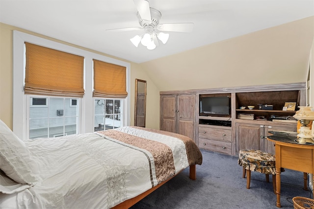 carpeted bedroom featuring vaulted ceiling and ceiling fan