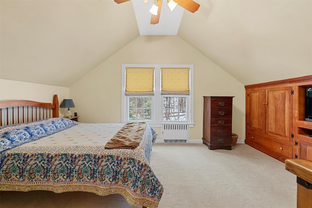 bedroom featuring lofted ceiling, radiator, light colored carpet, and ceiling fan