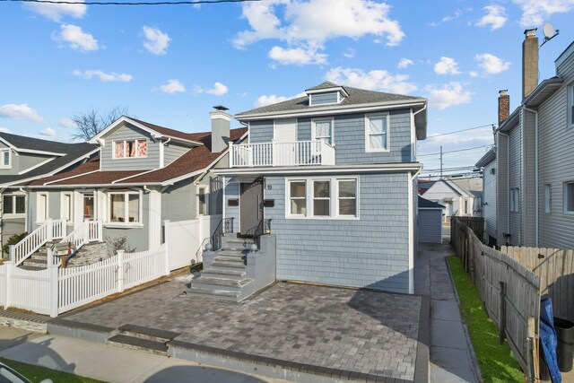 view of front of property with a balcony