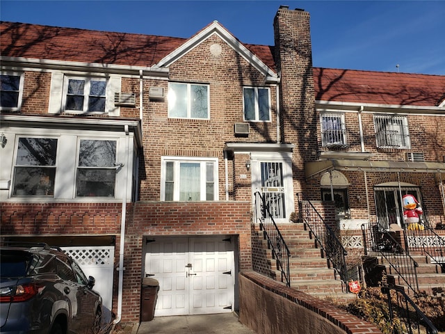 townhome / multi-family property featuring a garage