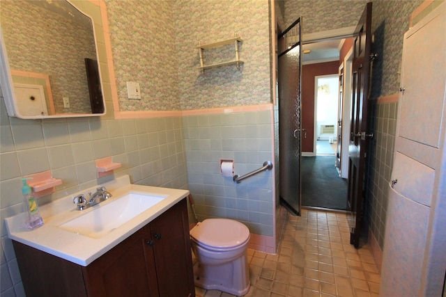 bathroom featuring vanity, tile patterned flooring, tile walls, and toilet