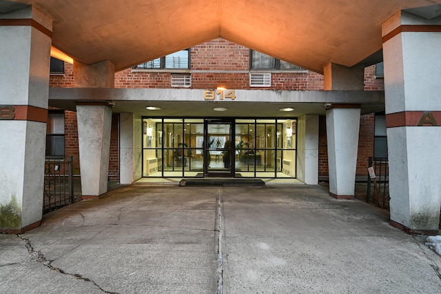 entrance to property with brick siding